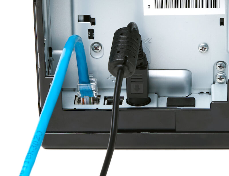Example of a receipt printer with a connected Ethernet cable.